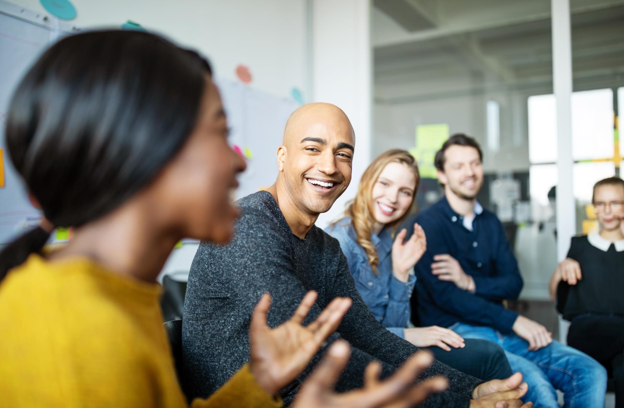 People at work talking during a meeting