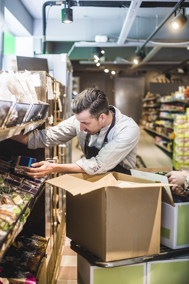 Stocking shelves in a supermarket