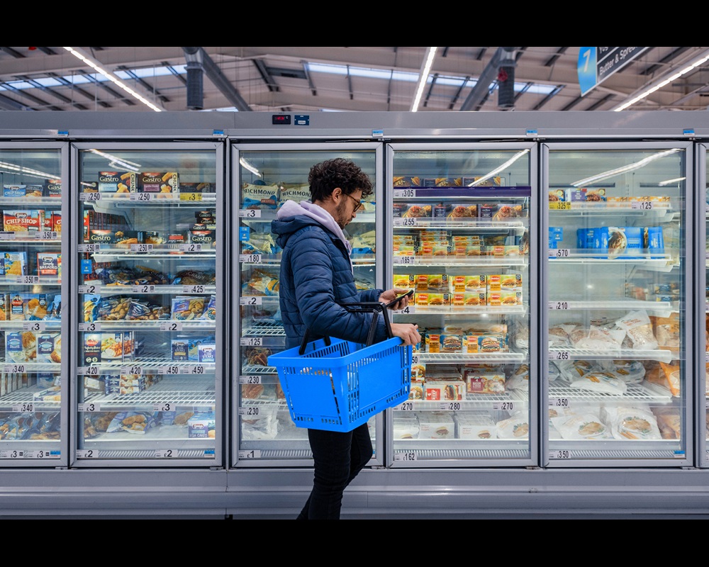 Guy in supermarket shopping